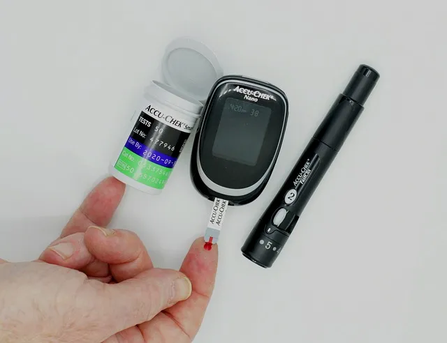 Close-up of a glucometer displaying blood sugar readings